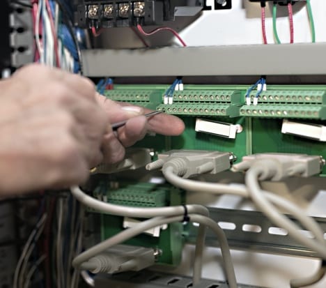 Man using tool to build a panel